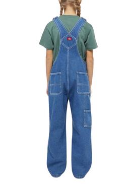 Salopette Dickies en jean bleu lavé pour fille.