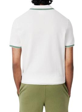 Polo Lacoste L.12.12 blanc à rayures vertes pour homme.