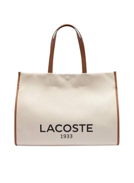 Sac fourre-tout Lacoste en toile beige de grande taille.