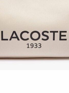 Sac fourre-tout Lacoste en toile beige de grande taille.