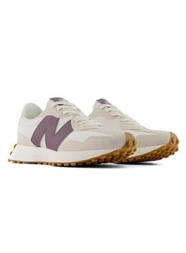 Sneakers New Balance 327 beige et violet pour femme.