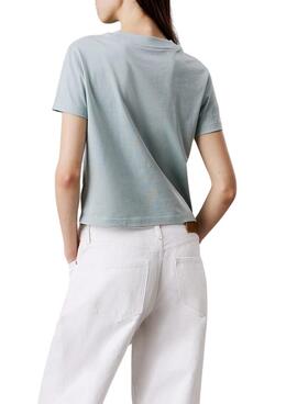 T-shirt Calvin Klein monologue bleue cropped pour femme.