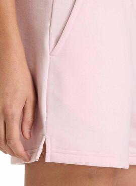 Shorts New Balance Essentials French Terry rose pour femme.
