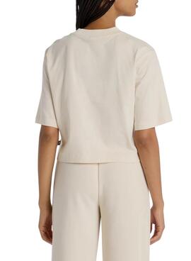 T-shirt New Balance Reimagined beige pour femme.