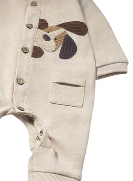 Barboteuse Mayoral avec des appliques brodées beige pour bébé.