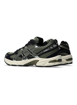 Baskets Asics Gel 1130 vertes et noires pour homme.