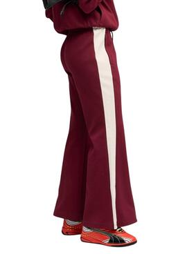 Pantalon de sport Puma évasé grenat T7 pour femme.