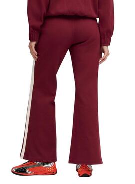 Pantalon de sport Puma évasé grenat T7 pour femme.