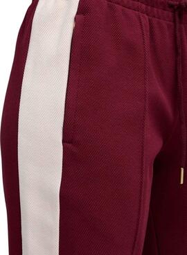Pantalon de sport Puma évasé grenat T7 pour femme.