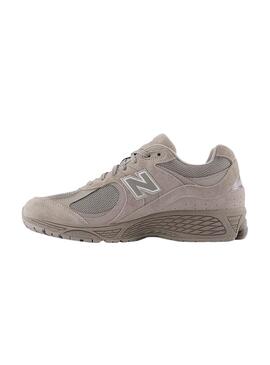Chaussures New Balance U2002R violettes pour homme.