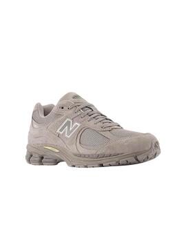 Chaussures New Balance U2002R violettes pour homme.